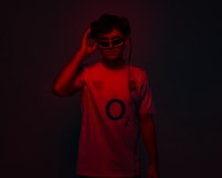 a man wearing sunglasses and a t - shirt